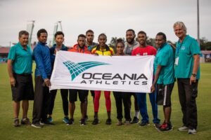 People Holding Banner Of Oceania Athletics